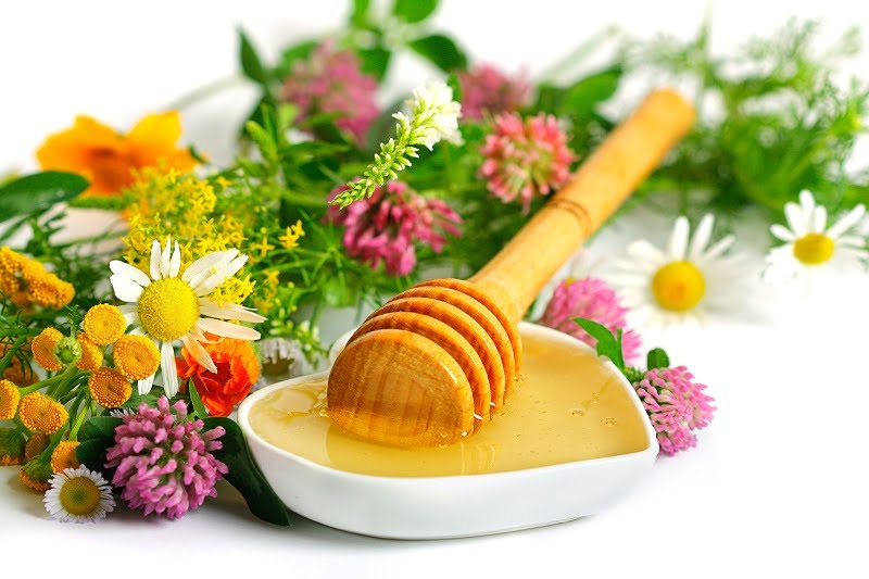 flowers and honey on a white background